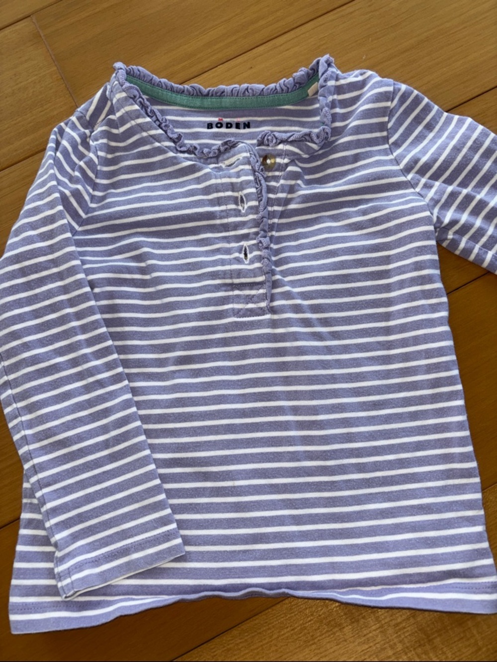 Mini Boden striped shirt with ruffle detail.